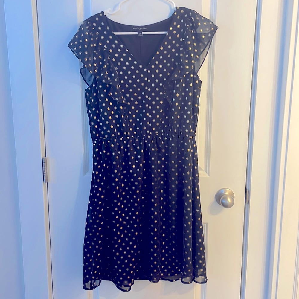 Eye-catching black and gold dress from Banana Republic. Size M. Smoke free home